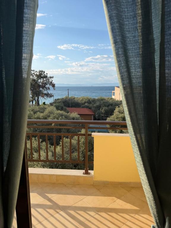 a view of the ocean from a balcony at Nikis studios in Skala Sotiros
