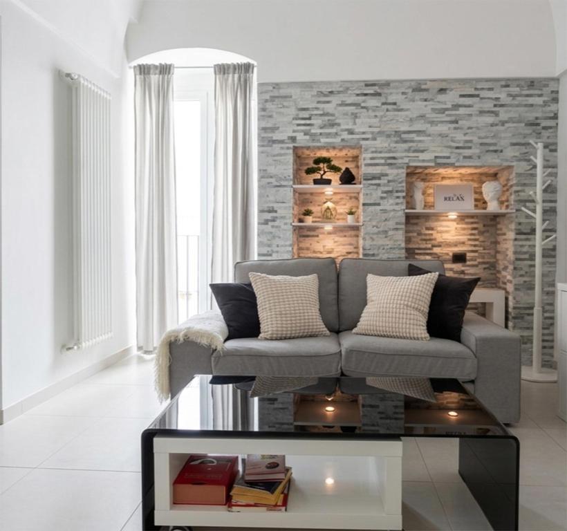 a living room with a couch and a table at Casa Margherita in Noci