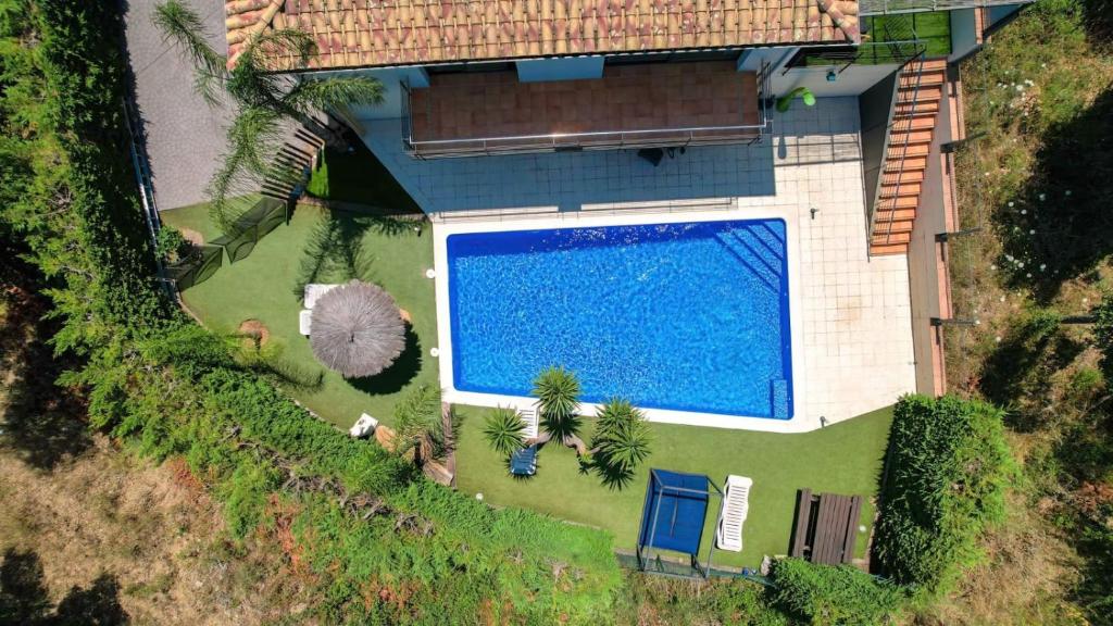 an overhead view of a swimming pool in a house at Caribe in Platja d'Aro