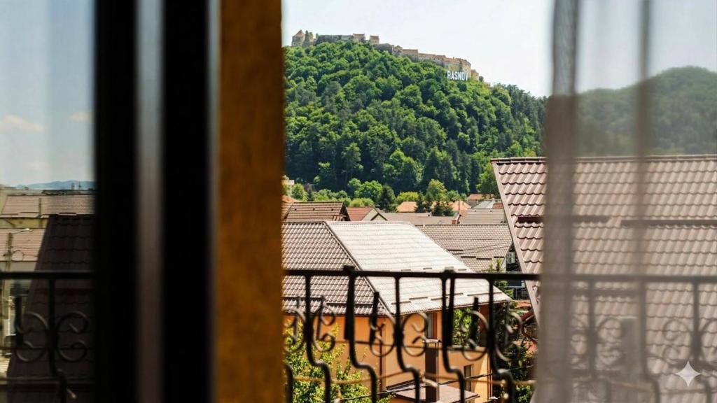 a view from a balcony with a view of a mountain at MAX International Hotel in Râşnov