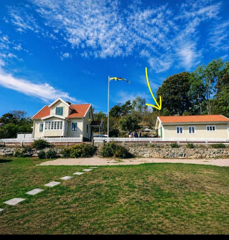 a kite flying in the sky over a house at Haus Alva in Ronneby
