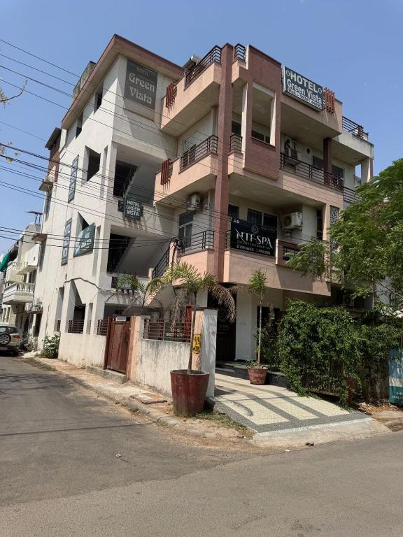 an apartment building on the side of a street at DG Hotel Green Vista in Jaipur