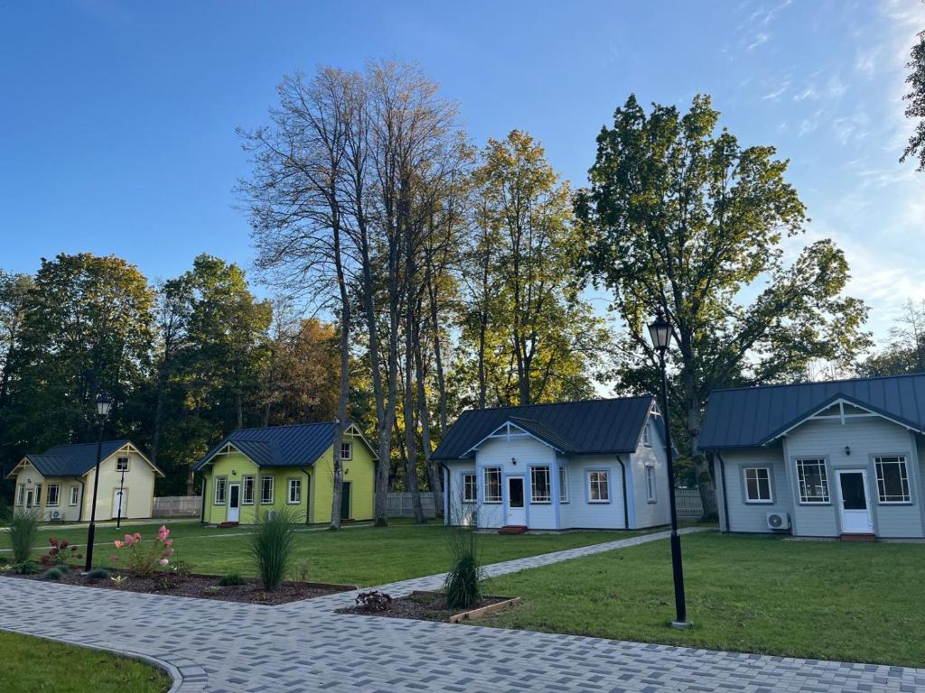 a row of houses in a park at Retro Ķemeri in Jūrmala
