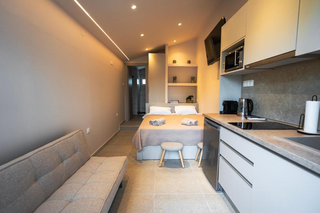 a small kitchen with a table in a room at Mediterranean Studio Halkidiki in Nea Kallikrateia