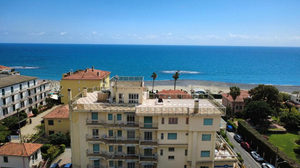 an aerial view of a building and the ocean at Casavacanze Internazionale in Diano Marina