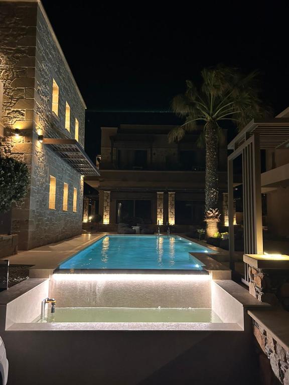 a swimming pool in the middle of a building at night at Xasteria in Elafonisi