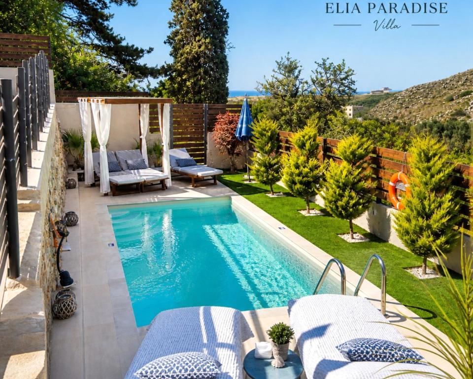 a swimming pool in the backyard of a house at Elia Paradise Villa with private Pool in Heraklio