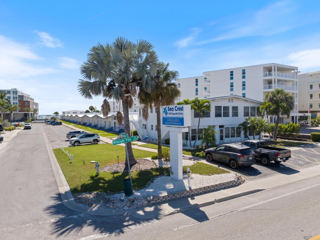 a street with cars parked on the side of a road at Sea Crest in Sarasota