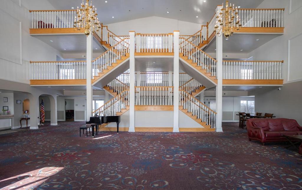a large room with a staircase in a building at Branson Towers Hotel in Branson