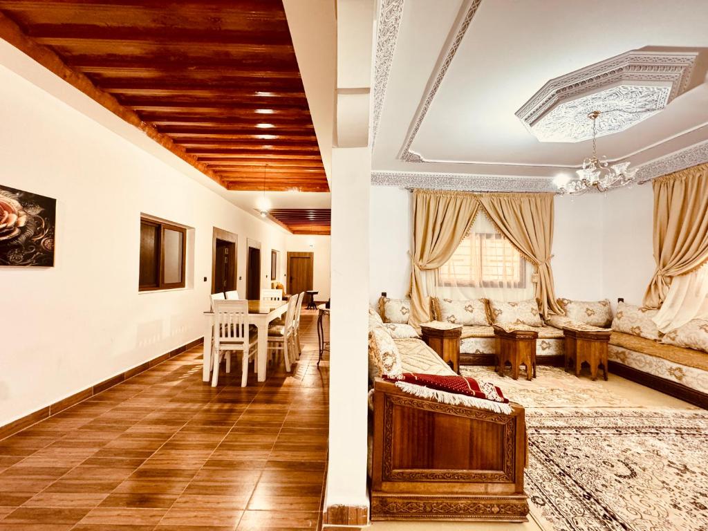 two views of a living room and a dining room at Marrakech ferme lodge in Marrakesh