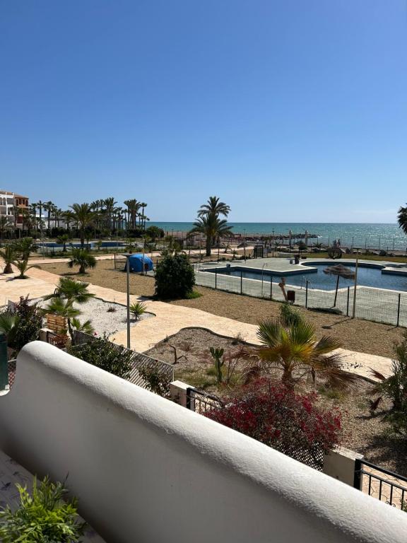 a view of the beach from the balcony of a resort at Apartment zona Naturista in Vera