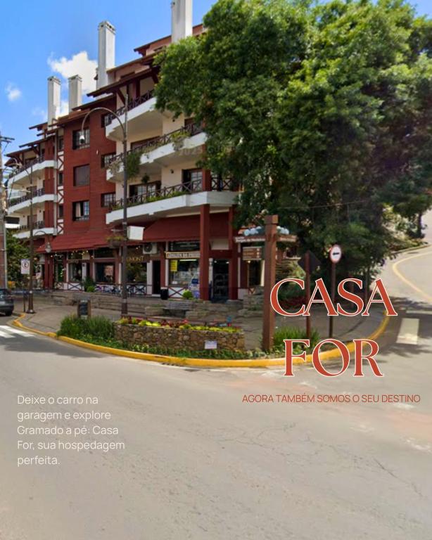 an advertisement for a casa for condos on a city street at Casa For Rua Torta in Gramado