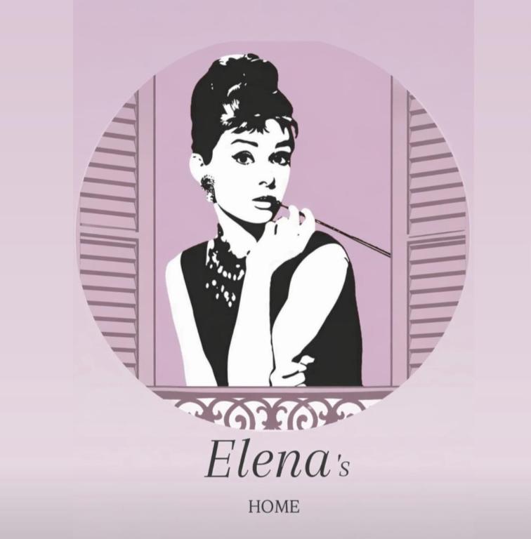 a woman brushing her teeth in front of a mirror at Elena 's HOME in Conversano