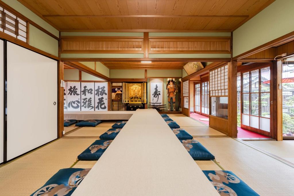 a large room with a long table in the middle at 民泊YADOOR East House & West House in Iga