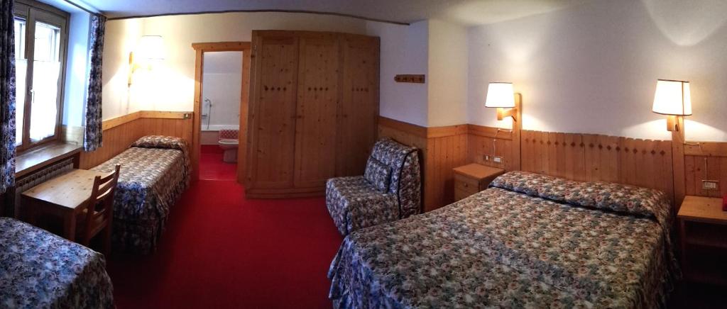 Postel nebo postele na pokoji v ubytování Hotel Locanda Grauson