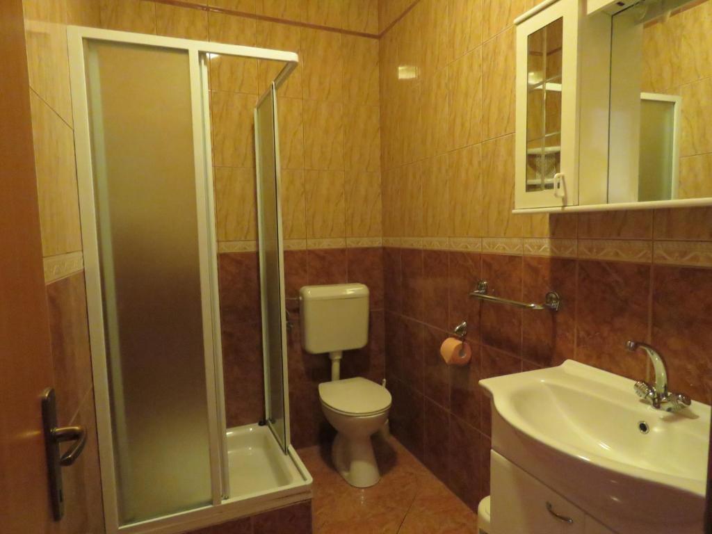 Koupelna v ubytování Apartments Palma Novalja