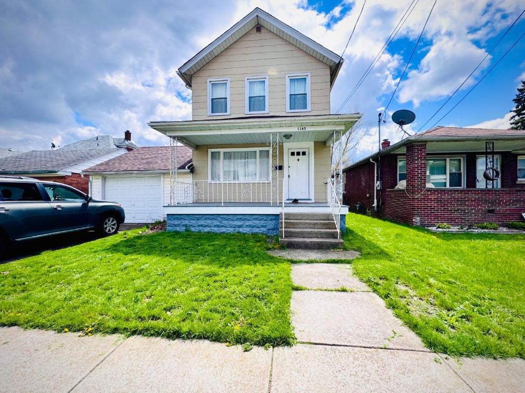 a house with a car parked in front of it at Niagara View at LaSalle SH in Niagara Falls