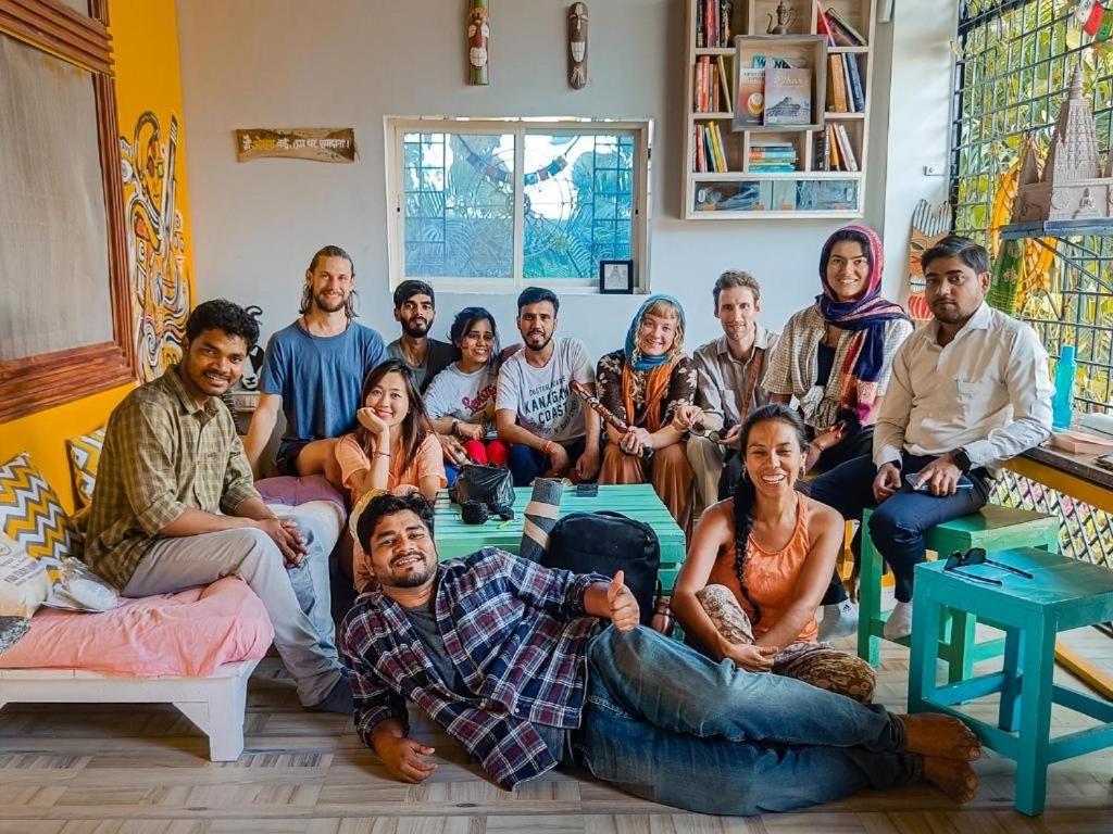 a group of people sitting in a living room at Thakur place in Mathura