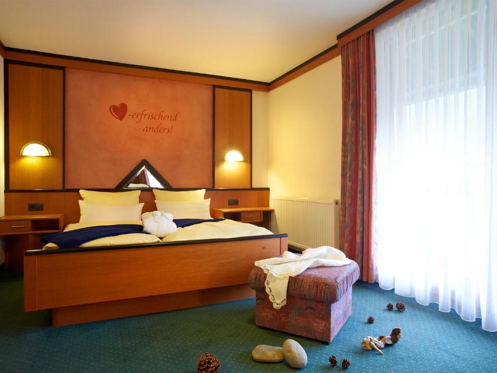Postel nebo postele na pokoji v ubytování Wanderhotel Grüner Baum