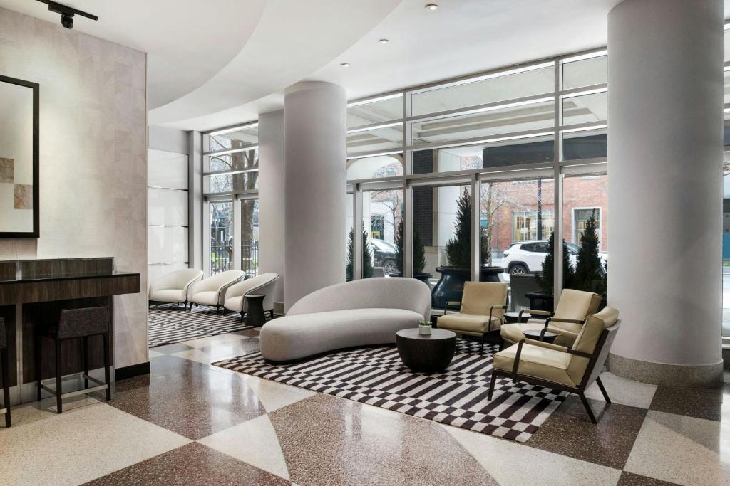a living room with chairs and a fireplace at Fairfield Inn and Suites Chicago Downtown/ Magnificent Mile in Chicago