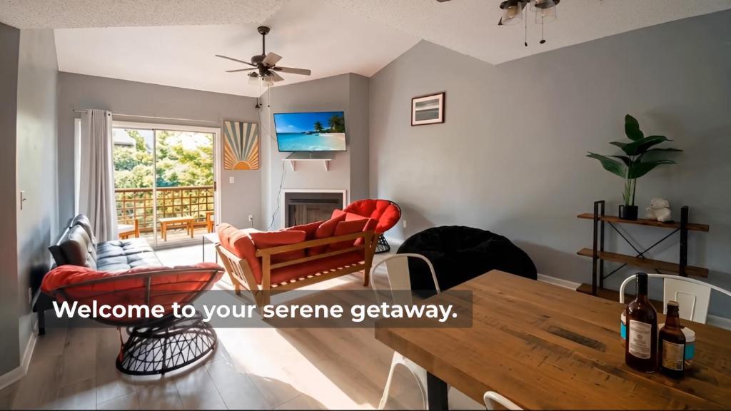 a living room with a wooden table and chairs at Corporate Retreat - Stylish 2BR Condo with Pool, Balcony & Fast Wi-Fi, Minutes from Downtown Wilmington in Wilmington