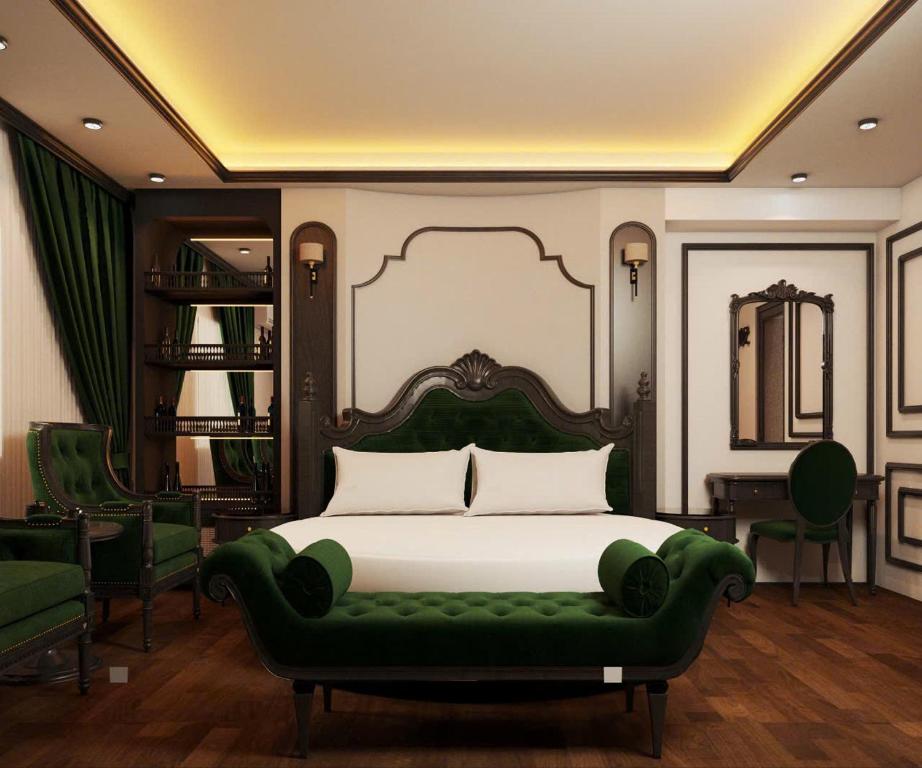 a bedroom with a green bed and a green couch at Villa Victoria Me Tri in Hanoi