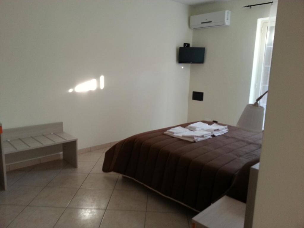 Postel nebo postele na pokoji v ubytování Il Girasole Formia Guesthouse rooms