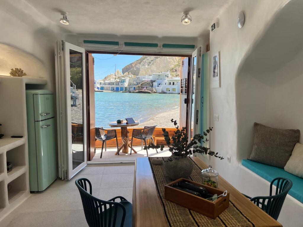 a living room with a view of the ocean at Naya seaside apartment in Firopótamos