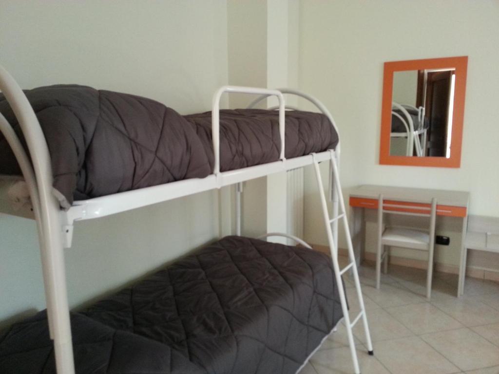 Postel nebo postele na pokoji v ubytování Il Girasole Formia Guesthouse rooms