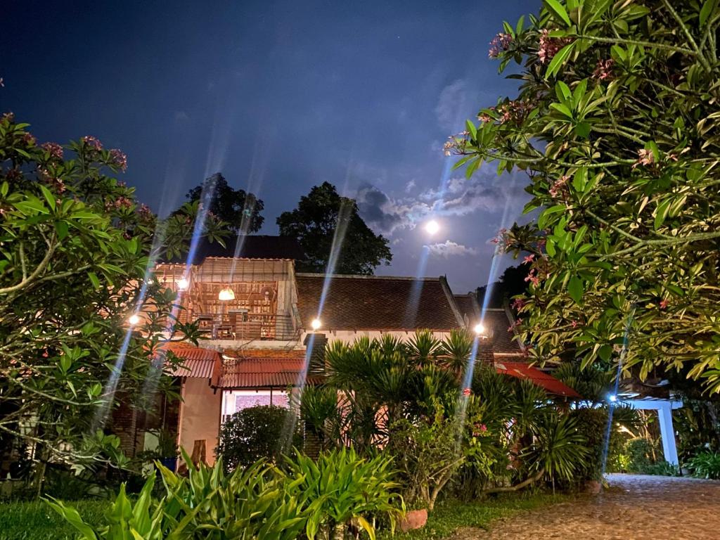 a house at night with lights in the yard at Sabbay Kep in Kep