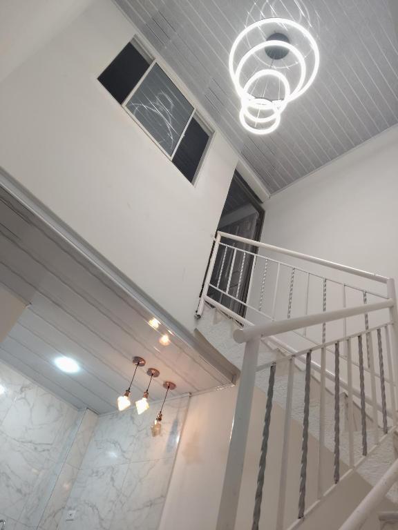 a spiral staircase in a building with a ceiling at Hermoso apartamento in Soledad