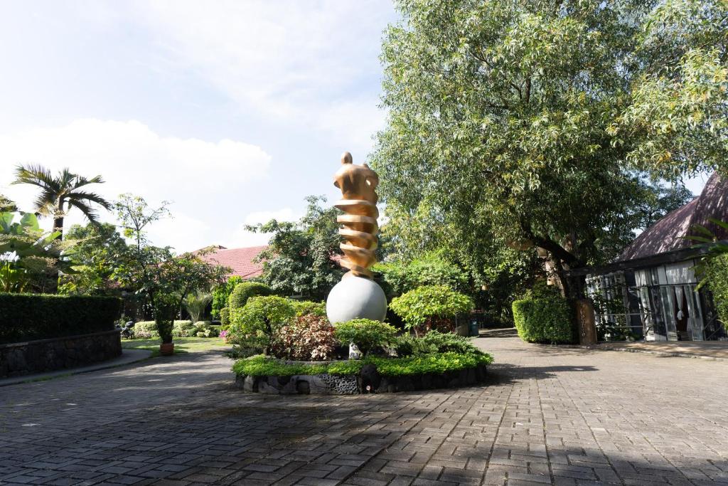 a statue of a hurricane in a park at Commander Suites de Velada in Antipolo