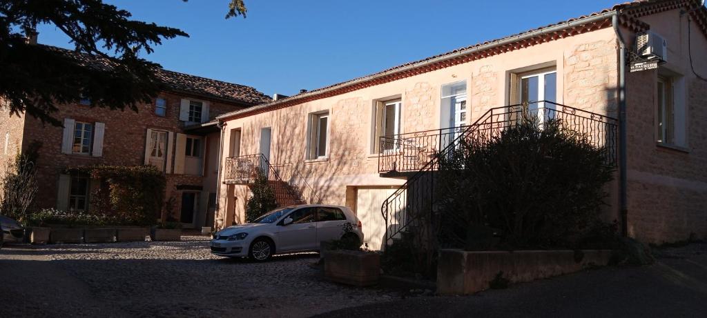 a white car parked in front of a building at Les Gites du Mont Ventoux in Bédoin