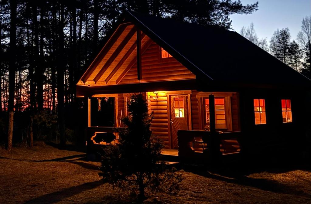 a small cabin with a light on the door at Nature Getaway Holiday Home in Mujaste