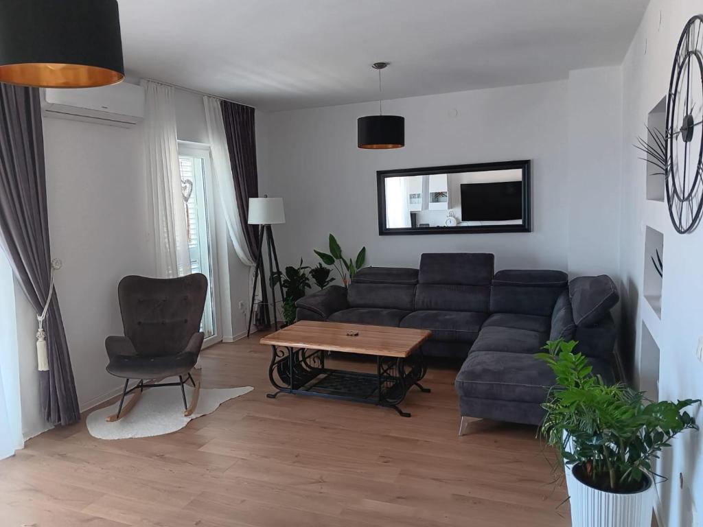 a living room with a couch and a table at Hanna in Dramalj