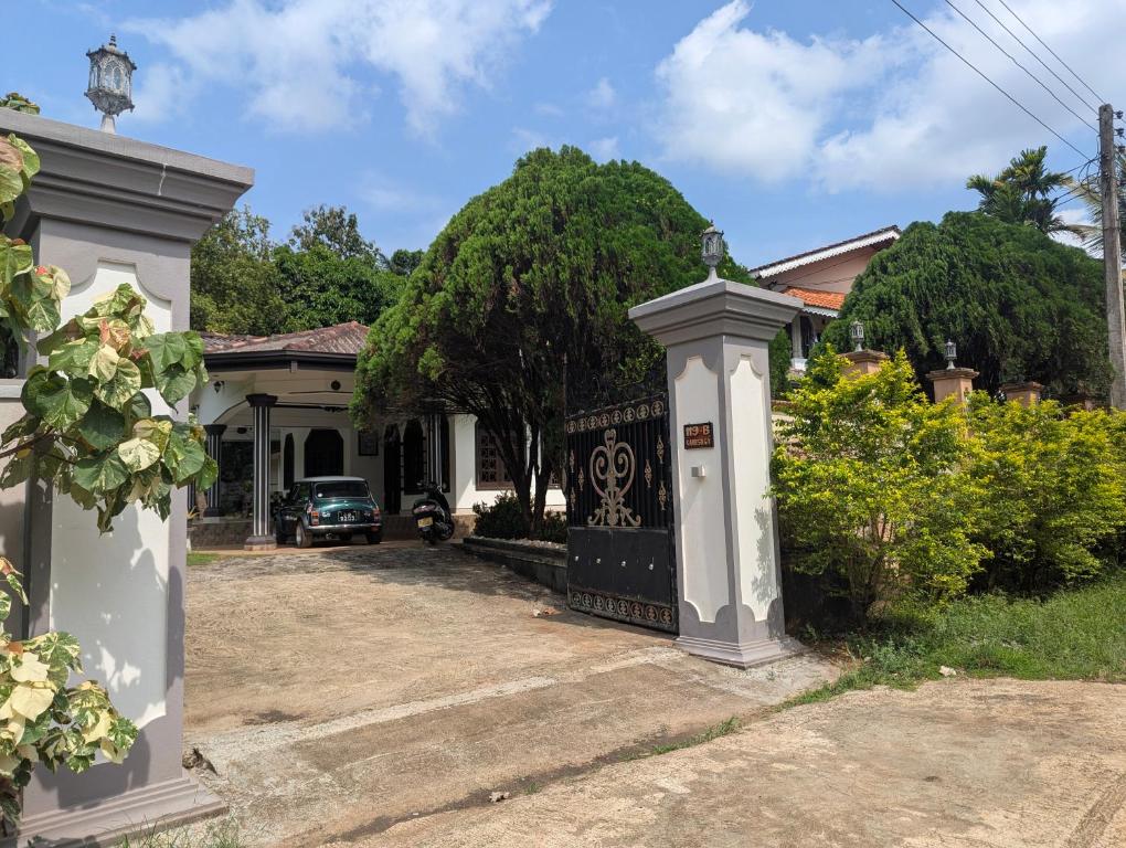 a house with a gate in front of it at Arangala View in Elhanyaya