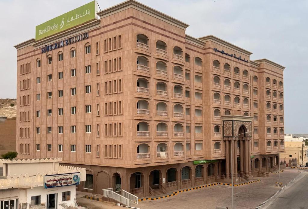 a large brick building with a sign on top of it at Samaraham Residency in Indāf