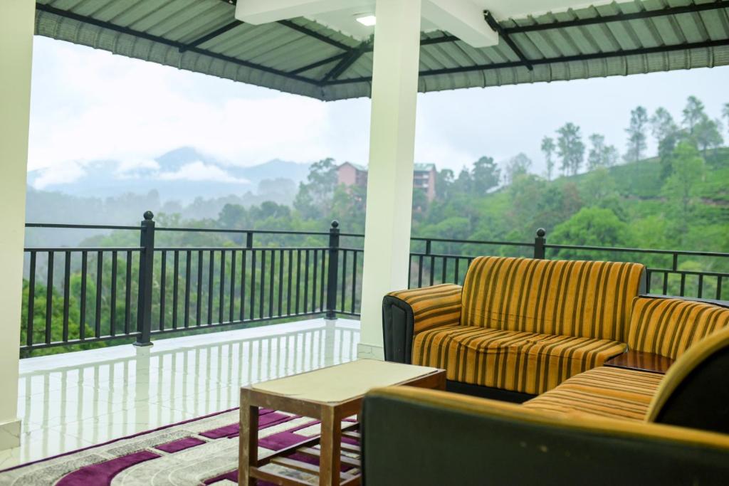 a screened in porch with a couch and a table at Ella RV Heaven World Hotel in Ella
