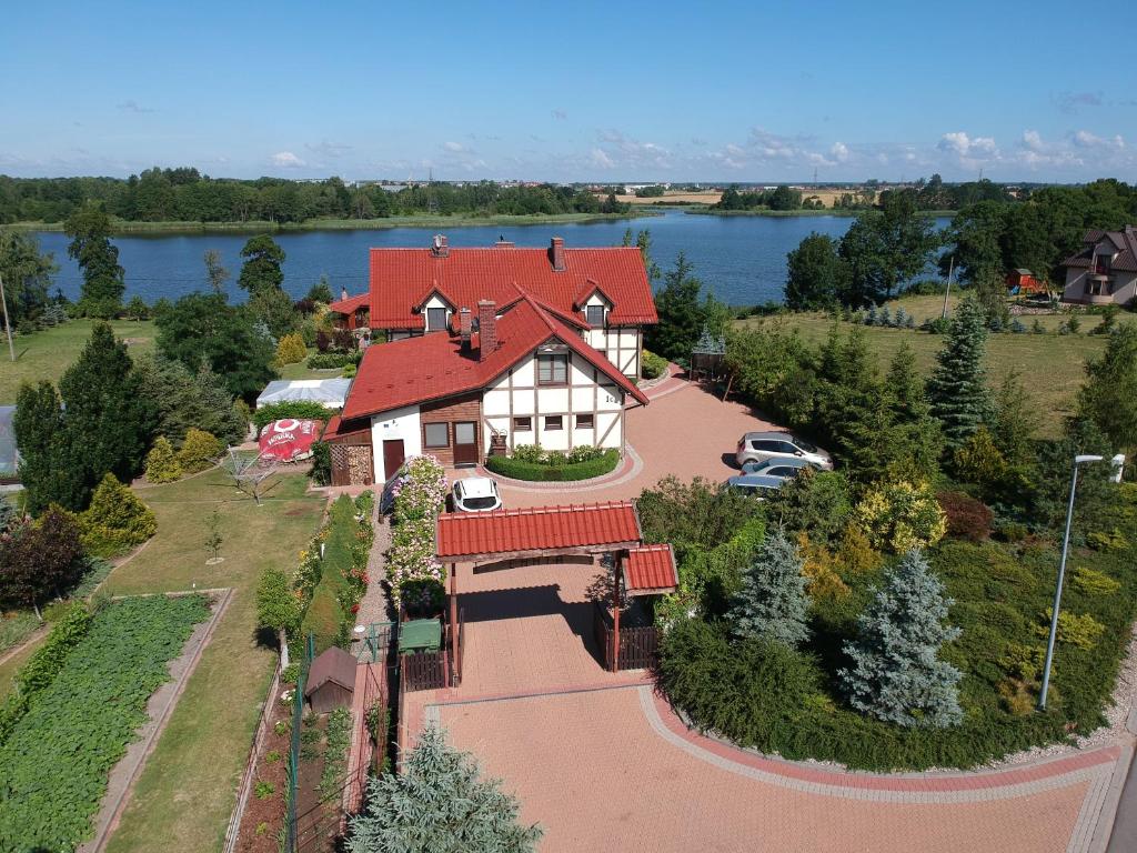 an aerial view of a house with a red roof at Agroturystyka Bobrowa Chata in Iława