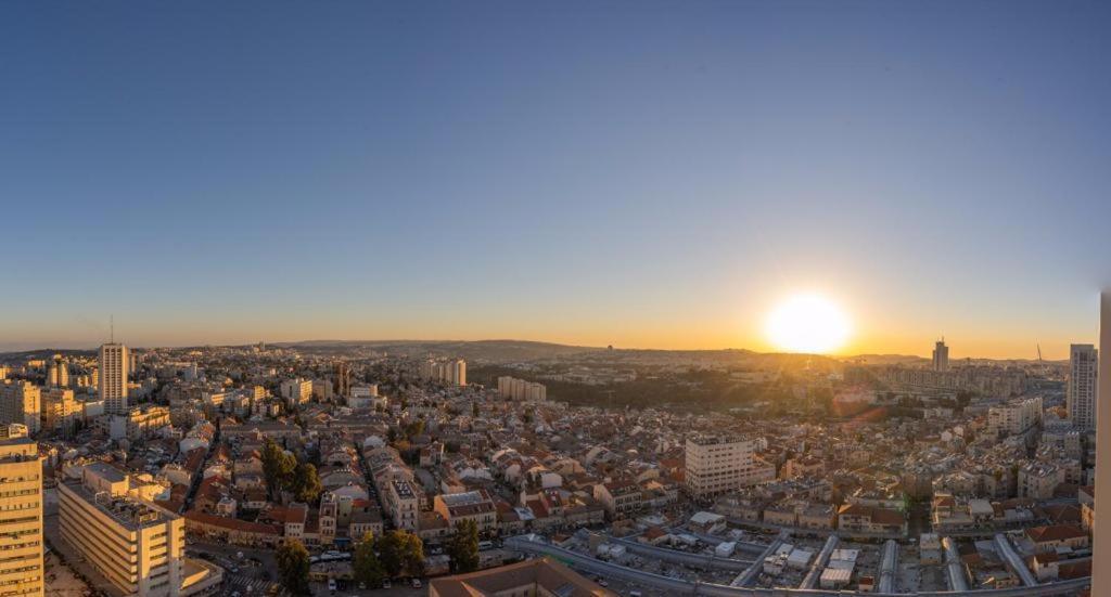 an aerial view of a city at sunset at JTower Royal Suites - Alefimmoed in Jerusalem