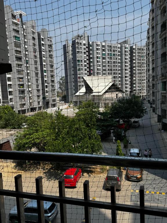 a view of a city with tall buildings and cars at Kavya royal in Mathura