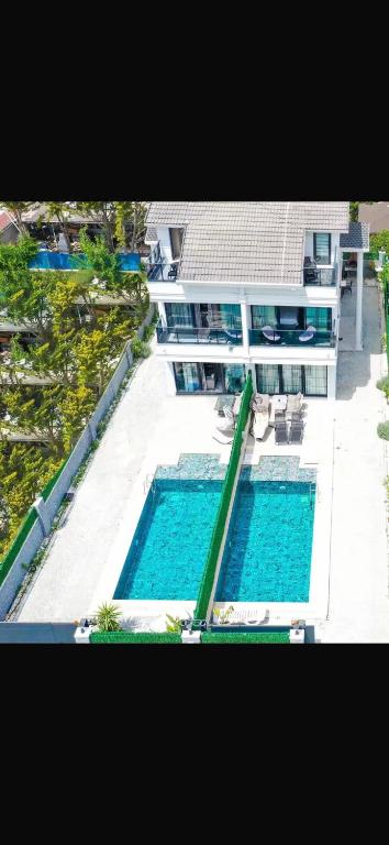 an aerial view of a building with two swimming pools at Villa Lolivia in Belek