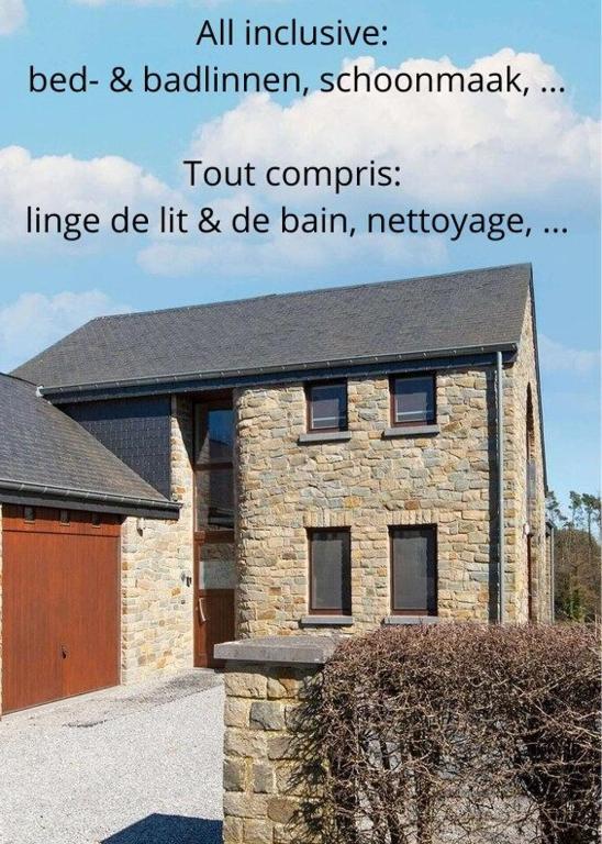 a brick house with a sign on the front of it at Villa Pal'Ange Hotelservice Playstation 5 Billiard in Durbuy