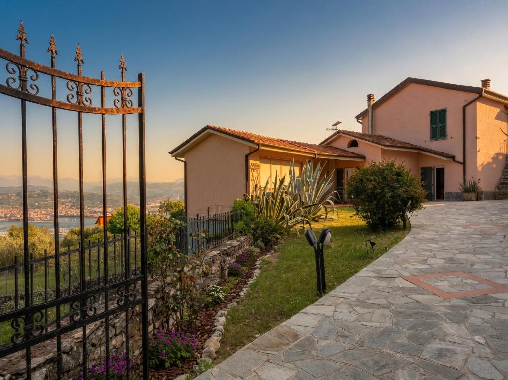a house with a gate in front of it at Il Collina - Poets'Vista in La Spezia