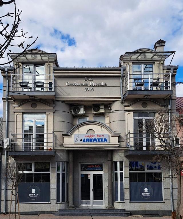 a building with two balconies on top of it at APARTMANI LAVAZZA in Vlasotince