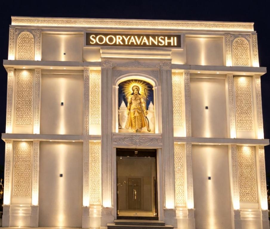 a building with a statue in the front of it at Hotel Sooryavanshi in Ayodhya