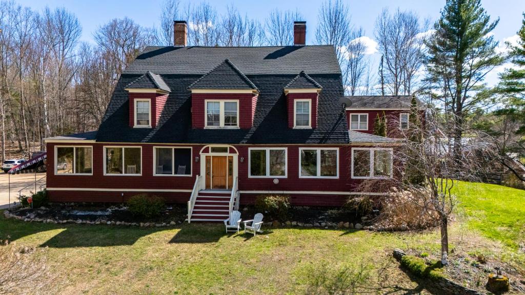 a red house with a black roof at Inn at Jackson in Jackson
