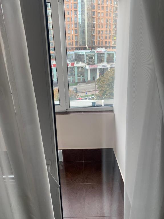 a window in a room with a view of a city at Genuez in Odesa