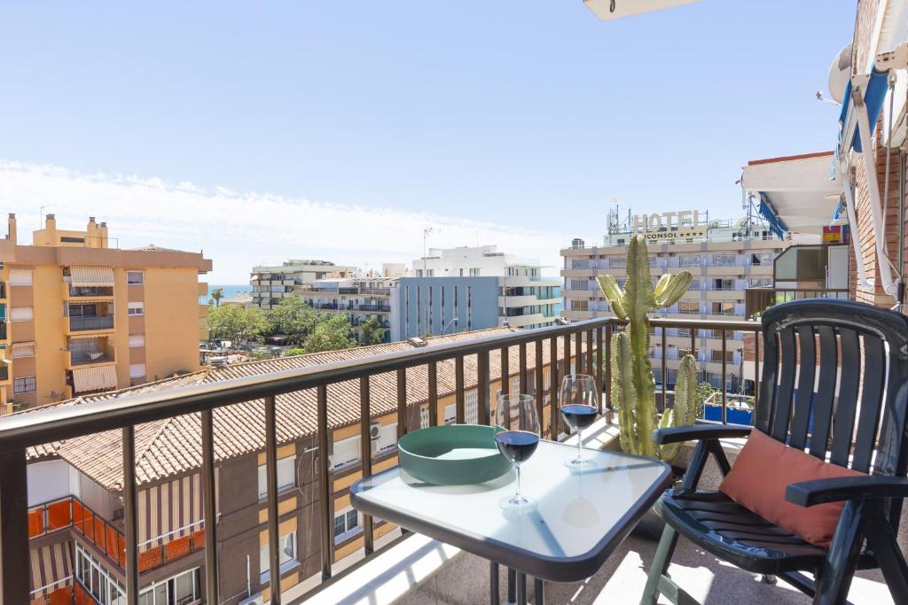 a table and chairs on a balcony with a view at ApartRincón Candelaria in Rincón de la Victoria