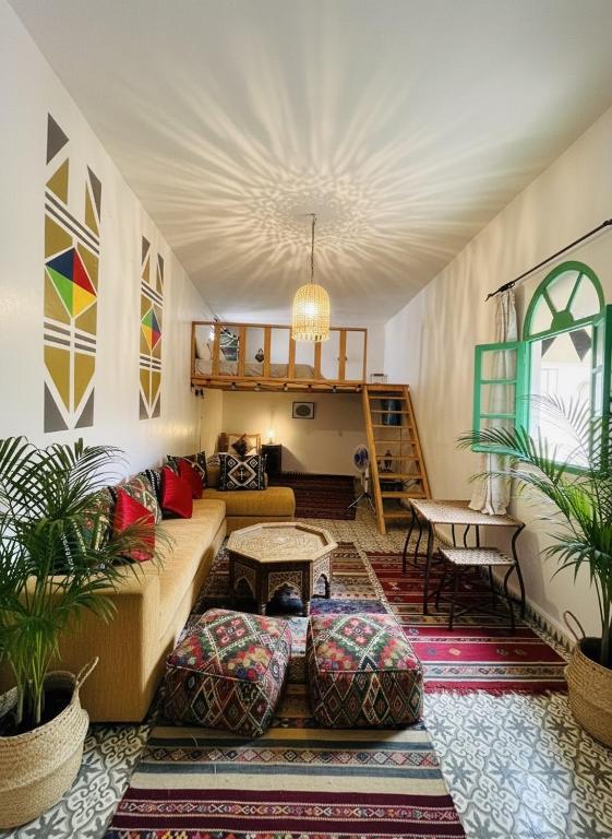 a living room with a couch and a table at Art studio 1 in El Jadida